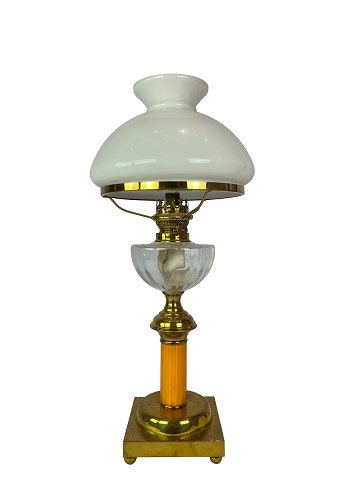 Kerosene lamp of brass with shade of white opaline glass and stem of orange 
glass from around 1860. 
Great condition
