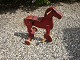 Three wheeled bike-horse in a reddish color and in good condition. 5000 m2 showroom.