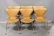 6 pcs Arne Jacobsen Model 3107. Re-upholstered with cognac colored patinated leather in good condition