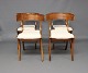 A set of 4 dining room chairs in polished walnut and seats in White fabric.5000m2 showroom.