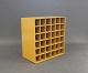 Bookcase in yellow by Montana with 36 smaller spaces for wine or similar.5000m2 showroom.