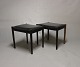 A pair of stools in classic black leather and rosewood of danish design from the 1960s.5000m2 showroom.
