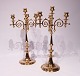 A pair of tall four armed brass candlesticks, in great vintage condition from around the 1880s.5000m2 showroom.