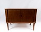 Smaller sideboard in teak with sliding doors of dansih design from the 1960s.5000m2 showroom.