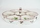 Ceramic cabaret dish decorated with flowers by Axel Brüel from around the 1930s.
5000m2 showroom.
