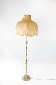 Floor lamp of brass and shade of fabric, in great antique condition. 
