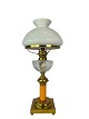 Kerosene lamp of brass with shade of white opaline glass and stem of orange 
glass from around 1860. 
Great condition
